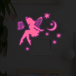 Glow-in-the-dark pink fairy and butterfly wall stickers applied above a light switch