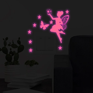 Detailed view of luminous pink fairy and butterfly wall stickers glowing in the dark