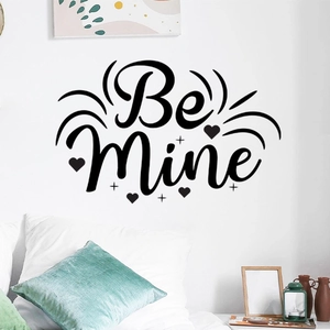 Close-up of Be Mine vinyl wall sticker with heart and star patterns in a bedroom