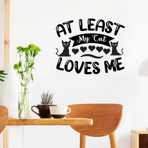 Detail of AT LEAST My Cat LOVES ME black wall sticker in a modern dining room setting