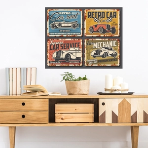 Set of four vintage car metal signs on white wall in a cozy home decor setting