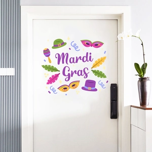 Detail of Mardi Gras door sticker with masks and feathers on white wooden door