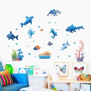 Detail of marine wall stickers with dolphins and coral in a cozy kids room setting