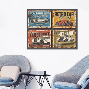 Detailed view of four vintage metal posters on a wall with retro classic car illustrations