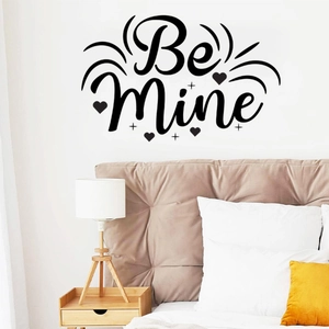 Detail view of Be Mine wall sticker with heart design on a cozy bedroom headboard wall