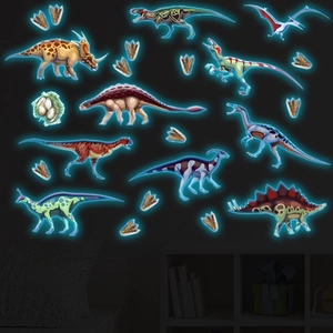 Luminous dinosaur wall stickers set with glowing triceratops and footprints for kids room