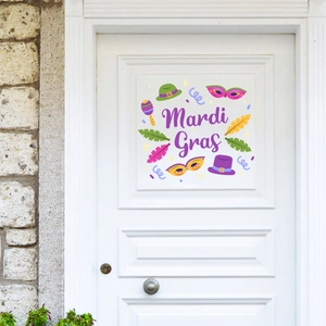 Detailed view of colorful Mardi Gras mask and hat stickers on a white wooden door