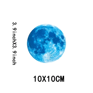 Detailed blue glow-in-the-dark moon wall sticker showing 10x10cm lunar surface textures