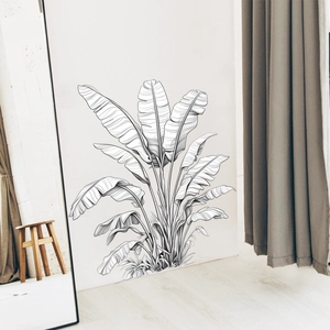 Minimalist black and white banana leaf wall sticker displayed in a modern home interior