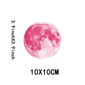 Detailed macro view of 10cm pink moon wall sticker with crater texture for kids' room