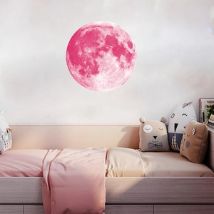 Luminous pink moon wall sticker with realistic crater textures for a cozy nursery decor