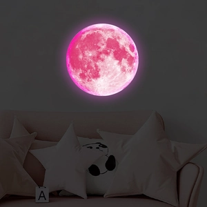 Luminous pink moon wall sticker showing realistic texture and soft glow in kids' bedroom