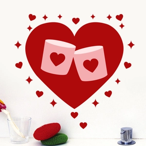 Detail of red heart wall sticker with pink mugs design on a modern kitchen wall surface
