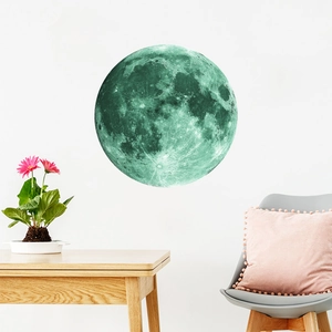 Detailed view of glow-in-the-dark moon wall sticker with realistic crater textures
