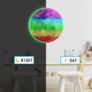 Luminous rainbow moon wall sticker showing day and night glow effect in kids room