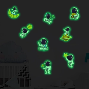 Luminous astronaut wall stickers with glowing moon and stars for kids' bedroom decor