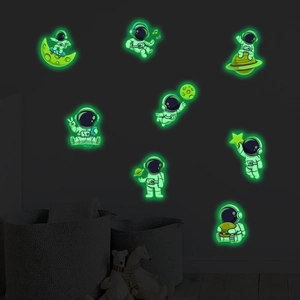 Luminous astronaut wall stickers with glowing planets and stars for kids' room decor