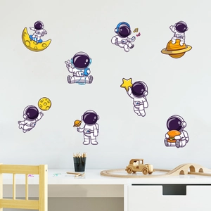 Luminous astronaut wall decals for kids room decor featuring creative space themes