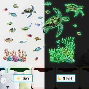 Glow-in-the-dark ocean wall stickers showing day and night fluorescent effect