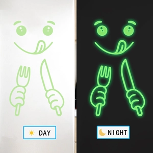 Luminous kitchen wall stickers with cute cartoon face showing day and night glowing effects