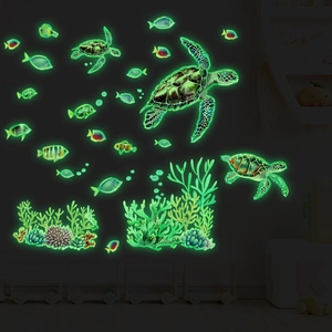 Luminous underwater wall stickers featuring sea turtles and coral glowing in the dark