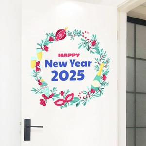 Close-up of Happy New Year 2025 door sticker with festive wreath on a white wooden door