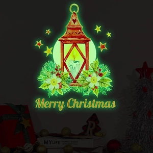 Detailed view of luminous Christmas lantern sticker with Merry Christmas text and pine needles