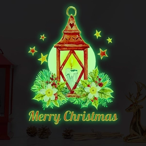 Detailed close-up of luminous Christmas sticker featuring red lantern and floral design