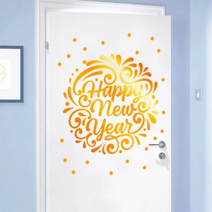 Detail showing a golden Happy New Year wall sticker applied to a white wooden door
