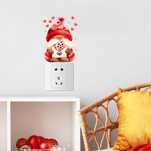 Close-up of a watercolor gnome sticker with red hearts above a white light switch