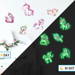 Luminous unicorn wall stickers showing day and night contrast with green fluorescent glow