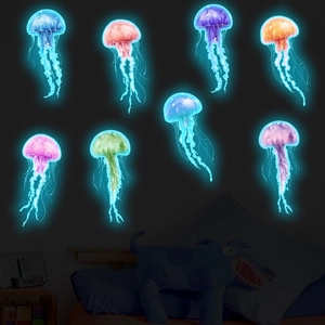 Luminous blue jellyfish wall stickers glowing in a dark bedroom setting for nursery decor