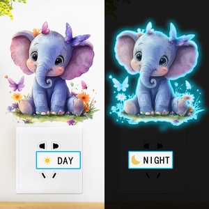 Luminous cute elephant wall sticker showing day and night glowing effect on light switch