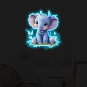 Glow-in-the-dark cute elephant wall sticker glowing around a light switch in a dark room