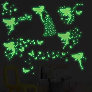 Glow-in-the-dark wall decals featuring glowing green fairies, moon and stars in bedroom