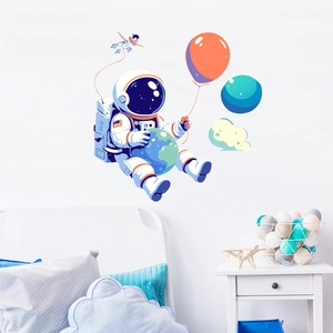 Luminous cartoon astronaut wall sticker with planet elements for kids bedroom decor