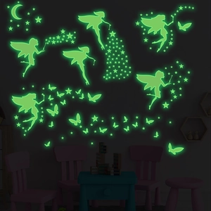Luminous wall stickers featuring fairies and stars glowing in the dark for kids room decoration