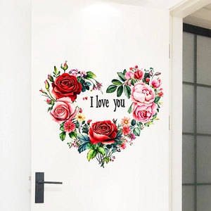 Detail of floral heart wall sticker with I love you text on a white interior door