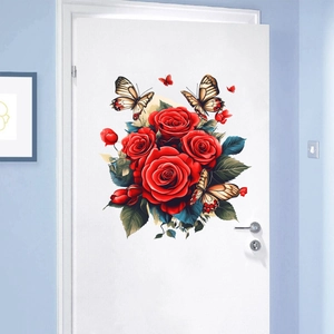 Detail of red rose and butterfly wall stickers on a white indoor wooden door