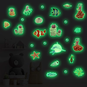 Luminous ocean creature wall stickers set glowing green in a dark bedroom scene