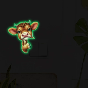 Glow in the dark cartoon highland cow wall sticker showing neon green light in the dark