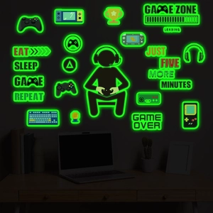 Luminous gaming wall stickers featuring controllers and game slogans in dark room setting