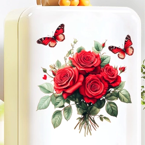 Detailed view of romantic red rose and butterfly wall stickers on a clean white surface