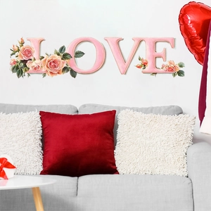 Romantic pink LOVE letters wall sticker with rose flowers above a sofa decoration
