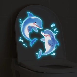 Autocollants de dauphins bleus luminescents brillant dans le noir sur un couvercle de WC