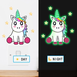 Luminous unicorn and stars switch stickers showing day and night glow effect