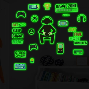 Luminous wall stickers featuring Game Zone slogan and glowing controllers in the dark