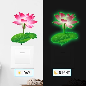 Glow-in-the-dark lotus wall sticker comparison showing day and night luminous effects