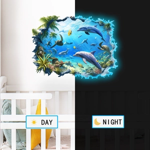 Luminous 3D ocean wall stickers showing day and night glowing effects in a nursery