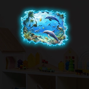 Luminous 3D ocean wall sticker with glowing dolphins and sea turtles in a dark bedroom